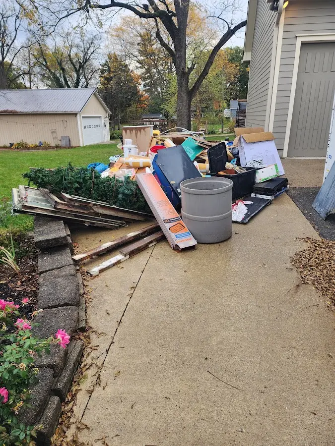 Dumpster being loaded with debris for 3 Yard Dumpster Rental in Discovery Bay